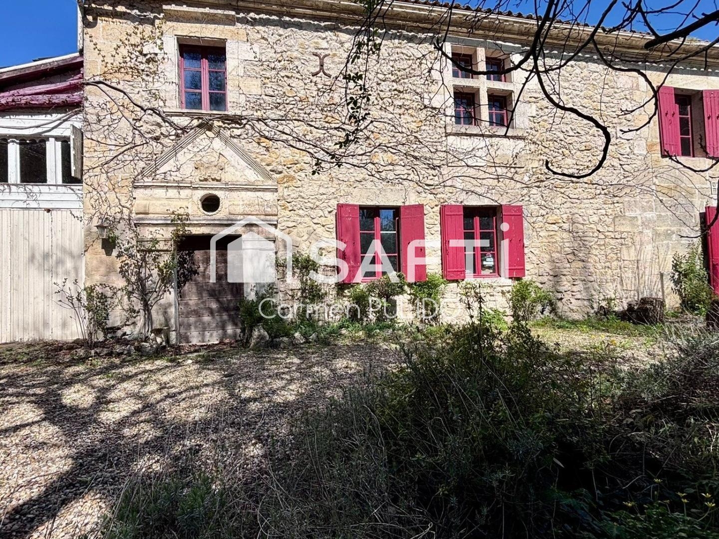 Charming former stone presbytery with studio, outbuildings, large garden, and swimming pool, located 30 minutes from Bordeaux.