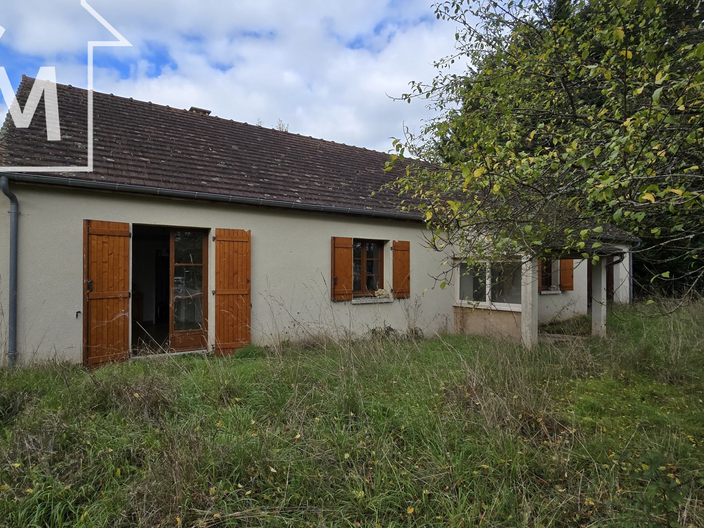 Maison de plain-pied avec garage et jardin clos