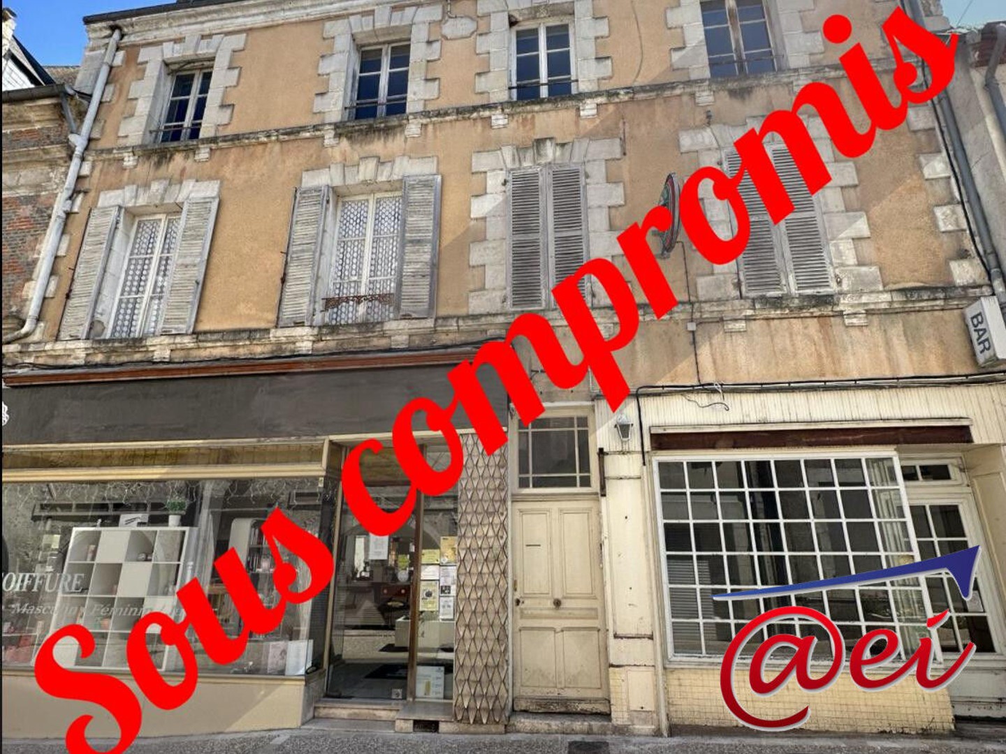 Immeuble de 3 appartements + 2 locaux commerciaux