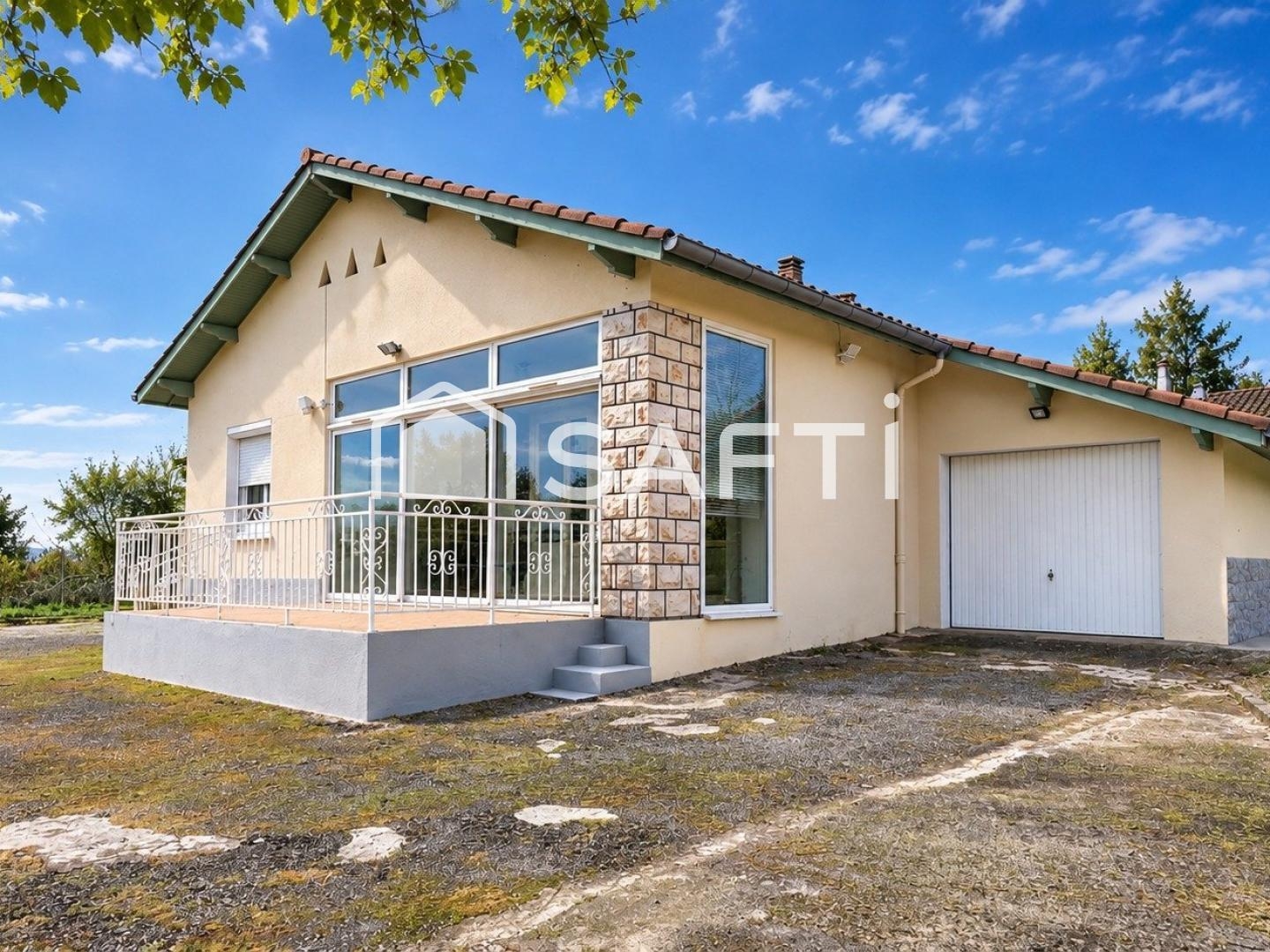 Maison avec garage et beau jardin