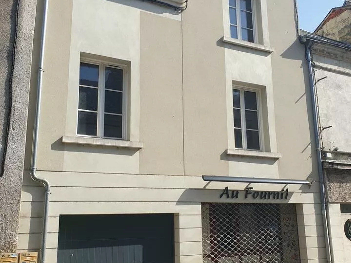IMMEUBLE COMPOSE D'UN LOCAL COMMERCIAL ET D'UNE HABITATION
