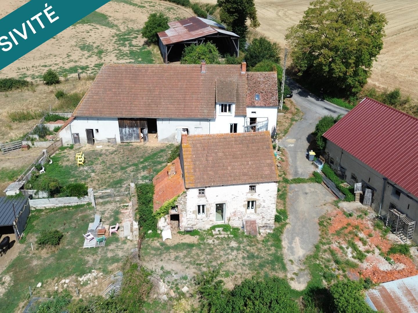 Écrin de verdure & potentiel d'exception : Ensemble immobilier de charme sur plus de 2 hectares à Lalizolle