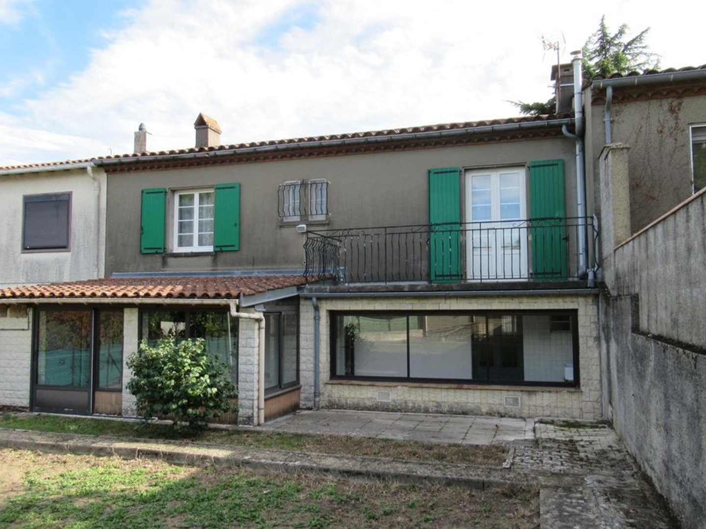 Maison de ville avec garage et jardin
